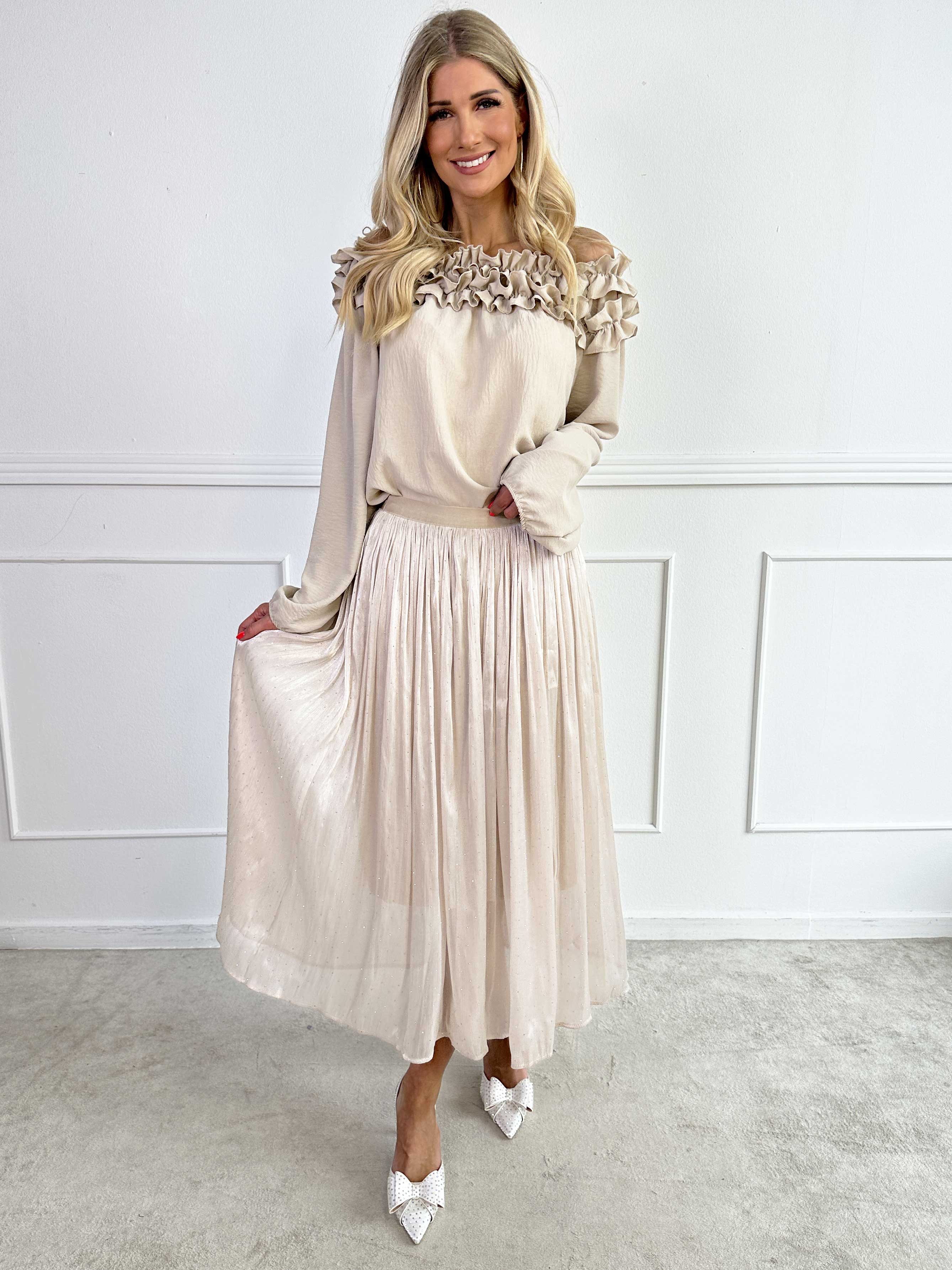 Afrodite - Feminin kjol i glansigt tyg med strass